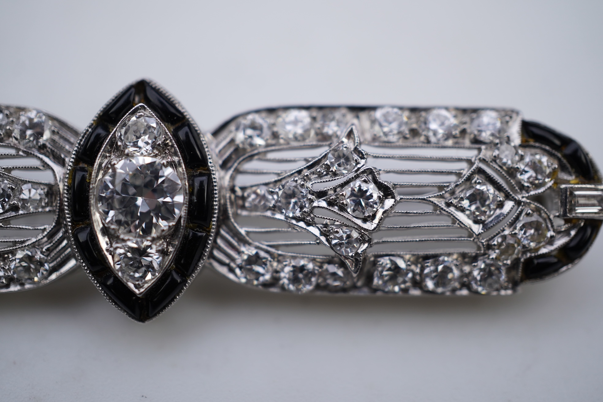 An Art Deco onyx and diamond brooch, 1920s